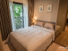 ห้องนอนตกแต่งด้วยผ้าม่านและวอลเปเปอร์ 11 @ Kawa Haus สุขุมวิท 77