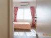 ห้องนอนเล็ก ตกแต่งด้วยผ้าม่านโทนสีชมพู 01 @ มัณฑนา ราชพฤกษ์-สะพานมหาเจษฎาบดินทร์ฯ