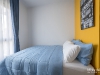 ห้องนอนใหญ่ตกแต่งด้วยผ้าม่าน สีน้ำเงิน 08 @ Notting Hill สุขุมวิท 105