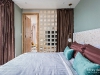 ห้องนอนสีเขียวตกแต่งด้วยผ้าม่านสีน้ำตาล 03 @ Omni Tower สุขุมวิท นานา
