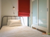 ห้องนอนเล็กตกแต่งด้วยผ้าม่าน สีแดง 02 @ Unio สุขุมวิท 72