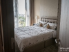 ห้องนอนตกแต่งด้วยผ้าม่าน วอลล์ 02 @ Whizdom Essence สุขุมวิท 101